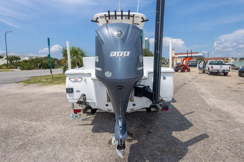 Slide: The Image of 2019 Sea Hunt BX25FS boat with Yamaha 300 outboard motor at a marina. - 17