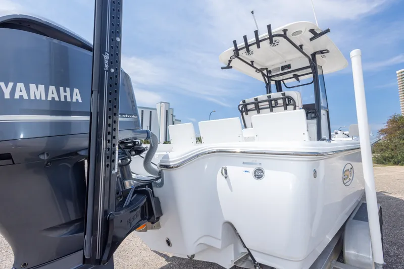 Slide: The Image of 2019 Sea Hunt BX25FS boat with Yamaha engine, parked on a trailer. - 55