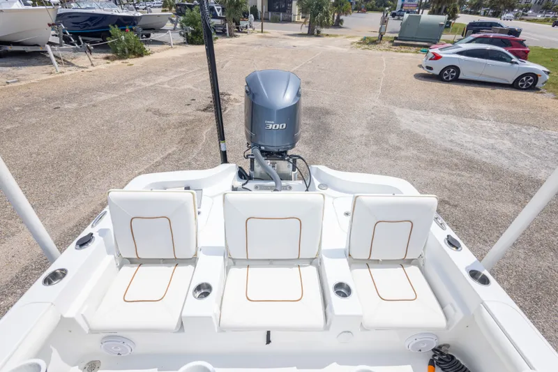 Slide: The Image of 2019 Sea Hunt BX25FS boat with Yamaha 300 engine, featuring three white cushioned seats. - 35