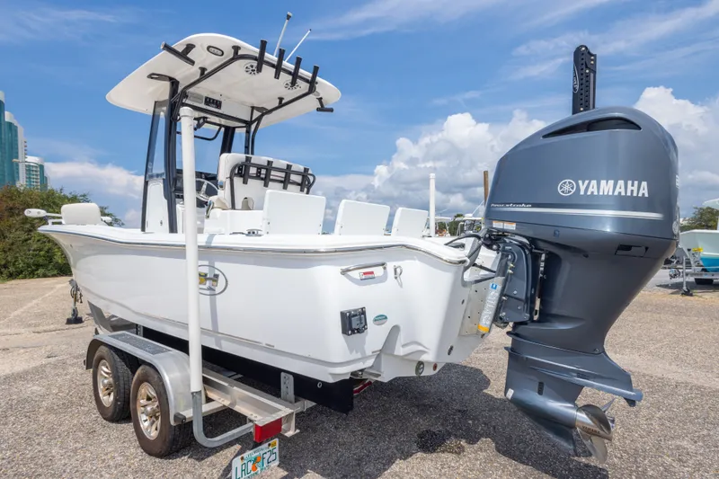Slide: The Image of 2019 Sea Hunt BX25FS boat with Yamaha engine on trailer, parked outdoors. - 16