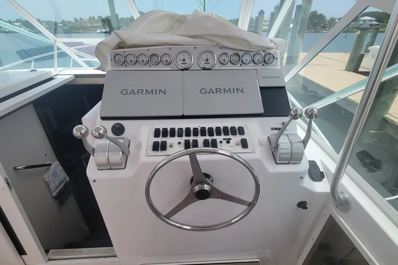 Slide: The Image of Helm of 1995 Cabo 35 Express boat with Garmin navigation system. - 7