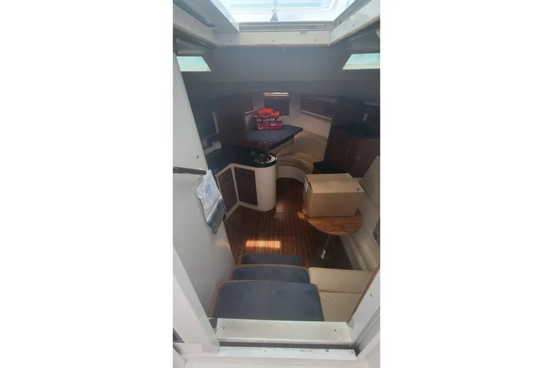 Slide: The Image of Interior view of 1995 Cabo 35 Express boat with seating and table. - 9