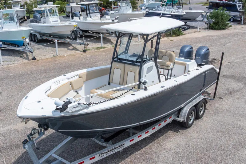Slide: The Image of 2016 Sea Fox 266 Commander boat on trailer, featuring dual engines and spacious seating. - 4