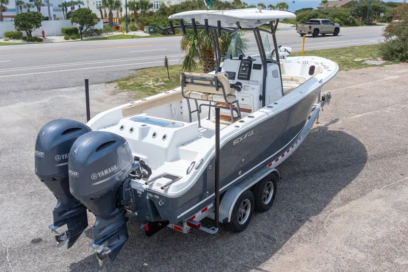 Slide: The Image of 2016 Sea Fox 266 Commander boat with dual Yamaha engines on a trailer. - 57