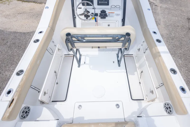 Slide: The Image of 2016 Sea Fox 266 Commander boat interior with seating and storage compartments. - 21