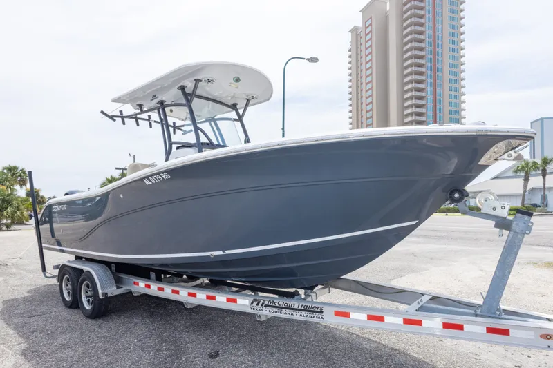 Slide: The Image of 2016 Sea Fox 266 Commander boat on trailer, parked near tall buildings. - 17