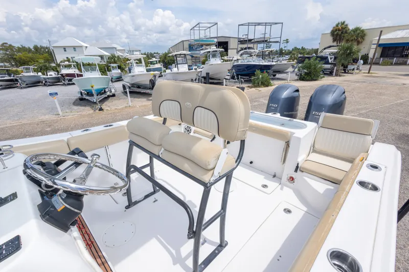 Slide: The Image of 2016 Sea Fox 266 Commander boat with dual engines, parked in a marina. - 26