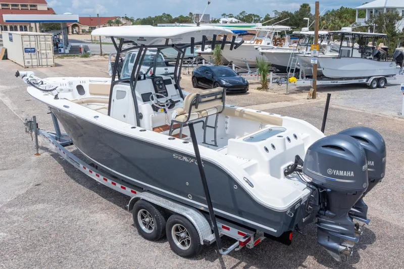Slide: The Image of 2016 Sea Fox 266 Commander boat with dual Yamaha engines on a trailer. - 55