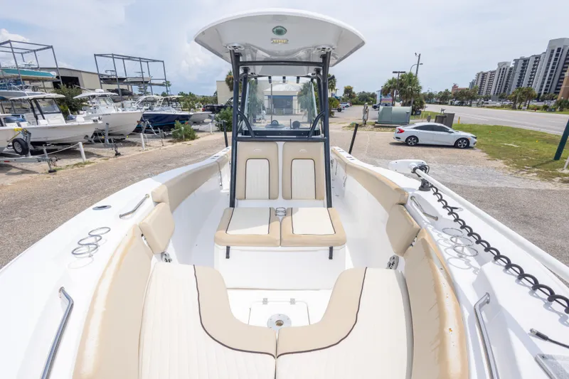 Slide: The Image of 2016 Sea Fox 266 Commander boat with spacious seating, docked near other boats. - 34