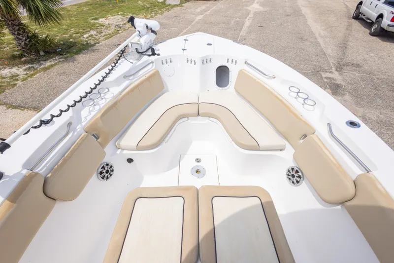 Slide: The Image of 2016 Sea Fox 266 Commander boat interior with beige seating and cup holders. - 36
