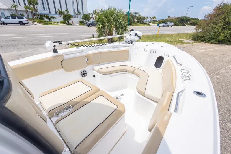 Slide: The Image of 2016 Sea Fox 266 Commander boat interior with beige seating and cup holders. - 38