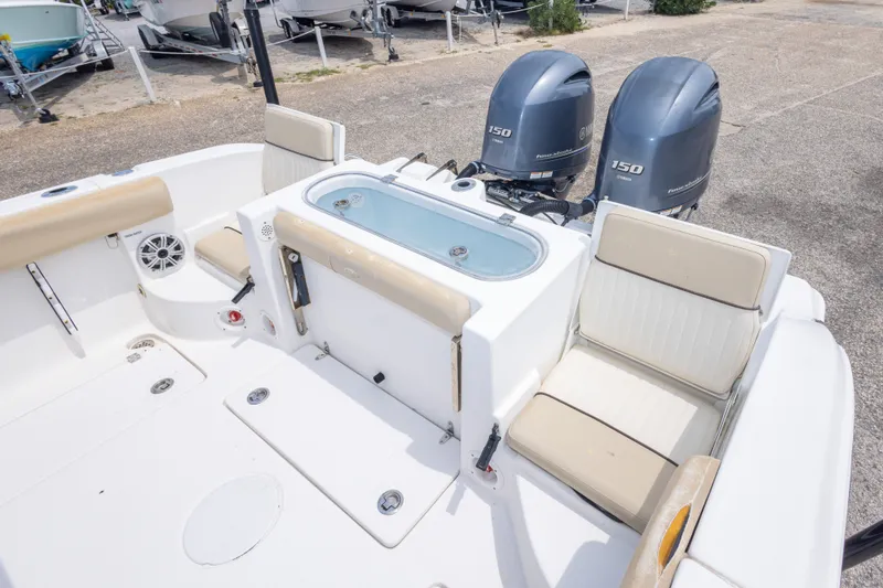 Slide: The Image of 2016 Sea Fox 266 Commander boat with dual engines and seating area. - 23