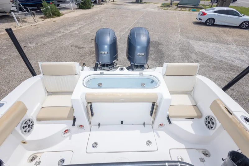 Slide: The Image of 2016 Sea Fox 266 Commander boat with dual engines and seating area. - 25