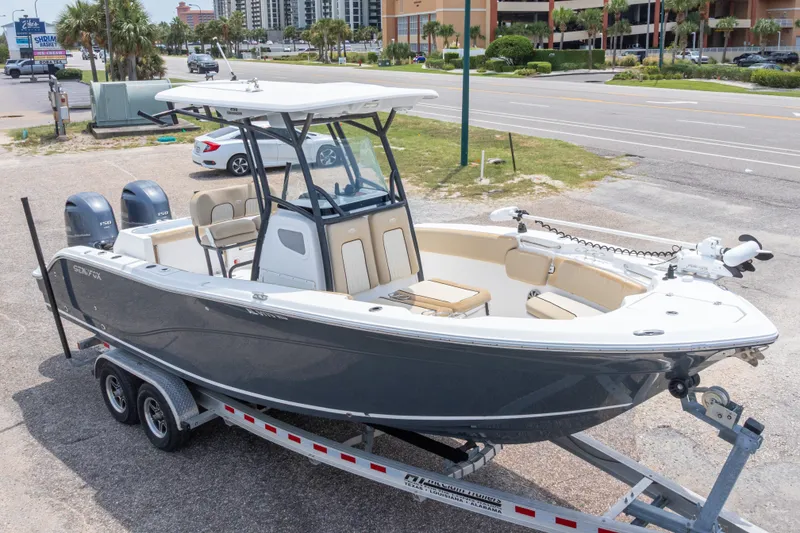 Slide: The Image of 2016 Sea Fox 266 Commander boat on trailer, parked near road. - 2