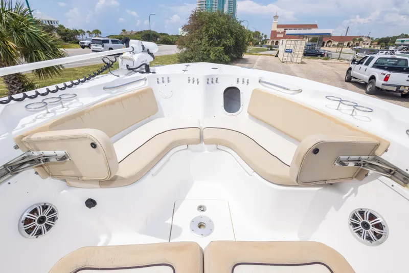 Slide: The Image of 2016 Sea Fox 266 Commander boat interior with beige seating and cup holders. - 31