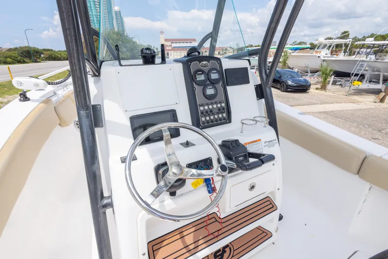 Slide: The Image of 2016 Sea Fox 266 Commander boat helm with steering wheel and control panel. - 43