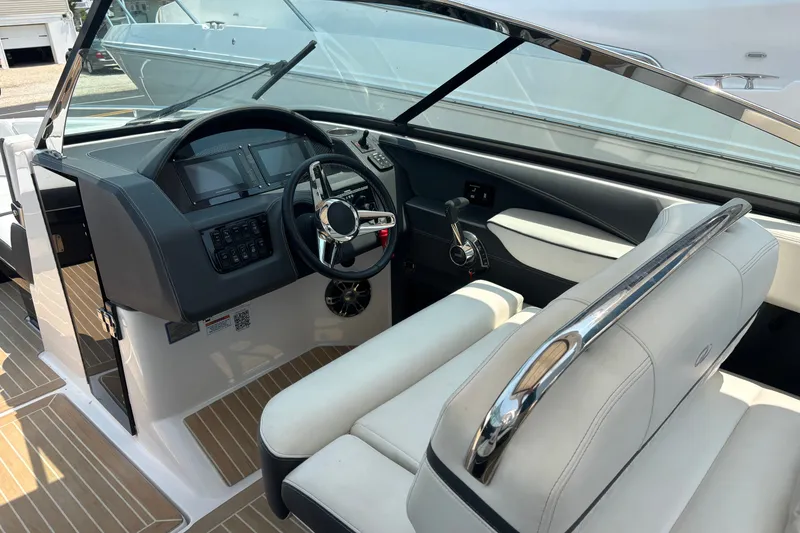 Slide: The Image of 2020 Regal 2800 Bowrider interior with sleek dashboard and comfortable seating. - 11