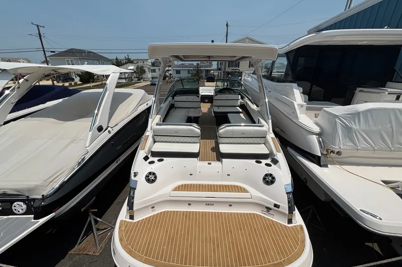 Slide: The Image of 2020 Regal 2800 Bowrider boat with spacious seating and sleek design in a marina. - 5