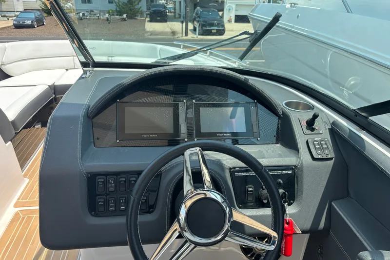 Slide: The Image of Cockpit of 2020 Regal 2800 Bowrider with steering wheel and digital displays. - 12