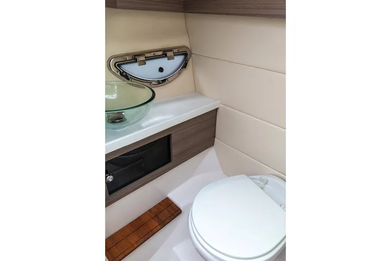 Slide: The Image of Manufacturer Provided Image: 2020 Regal 2800 Bowrider boat bathroom with modern sink and toilet. - 18