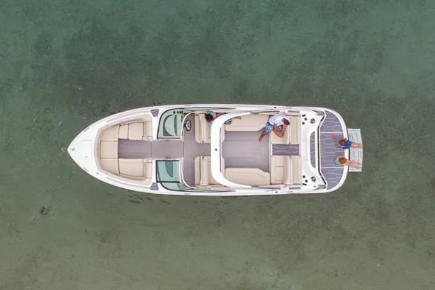 Slide: The Image of Manufacturer Provided Image: Aerial view of a 2020 Regal 2800 Bowrider boat on clear water. - 16