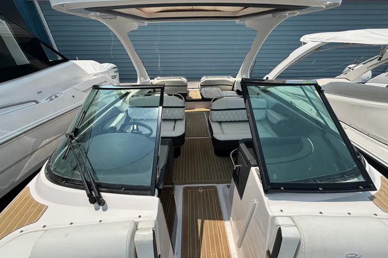 Slide: The Image of 2020 Regal 2800 Bowrider boat with open cockpit and sleek design. - 10