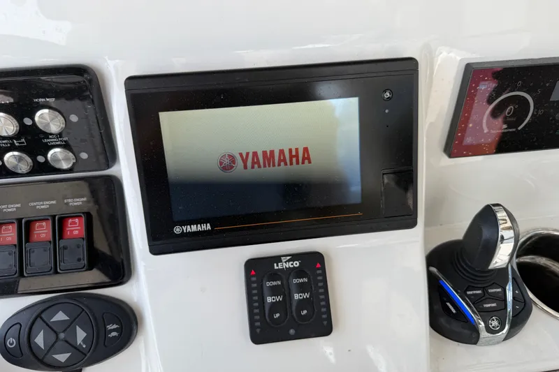 Slide: The Image of Control panel of a 2021 Caymas 341 CC boat featuring Yamaha display and controls. - 55