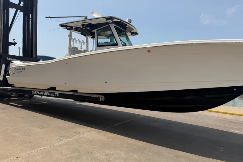 Slide: The Image of 2021 Caymas 341 CC boat on trailer at Surfside Beach, TX. - 6