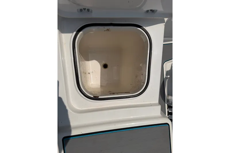 Slide: The Image of Open storage compartment on 2021 Caymas 341 CC boat. - 65