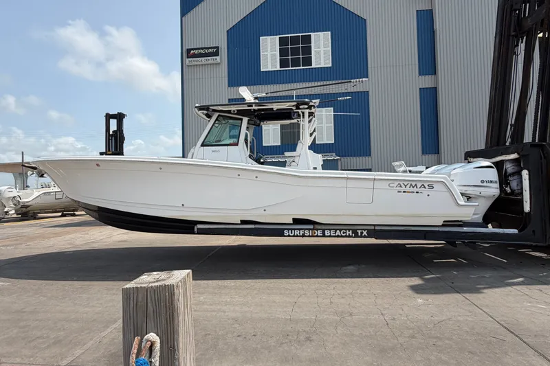 Slide: The Image of 2021 Caymas 341 CC boat on lift at Surfside Beach, TX marina. - 3