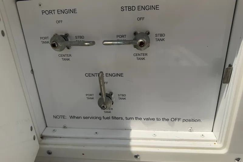 Slide: The Image of Control panel of a 2021 Caymas 341 CC boat, showing engine fuel valve settings. - 60