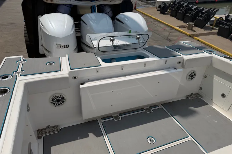 Slide: The Image of 2021 Caymas 341 CC boat deck with Yamaha 300 engines at dock. - 13