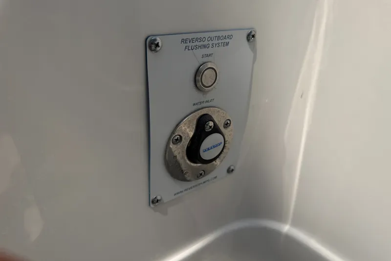 Slide: The Image of Reverso outboard flushing system on 2021 Caymas 341 CC boat. - 64