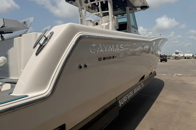 Slide: The Image of 2021 Caymas 341 CC boat docked at Surfside Beach, TX under a clear sky. - 8