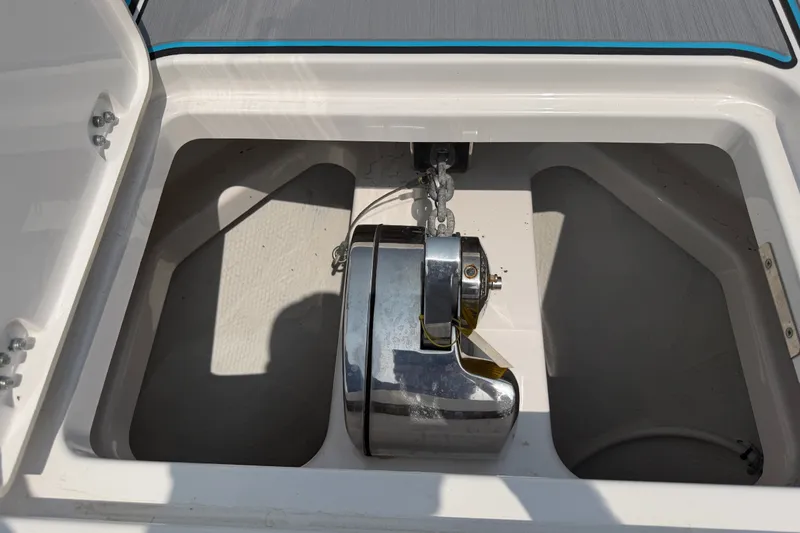 Slide: The Image of Anchor compartment of 2021 Caymas 341 CC boat with stainless steel windlass. - 25