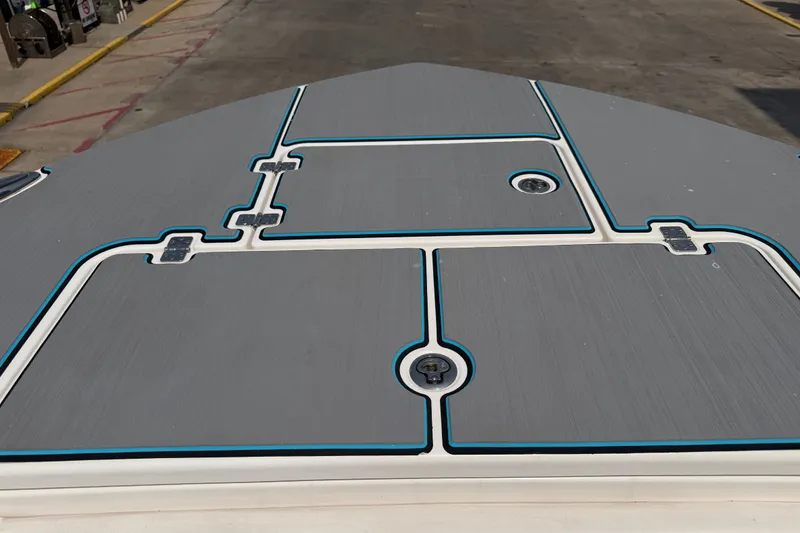 Slide: The Image of 2021 Caymas 341 CC boat deck with sleek gray and blue design. - 21