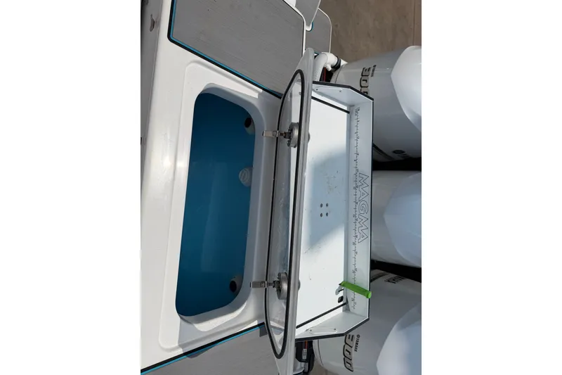Slide: The Image of Livewell and cutting board on 2021 Caymas 341 CC boat. - 66