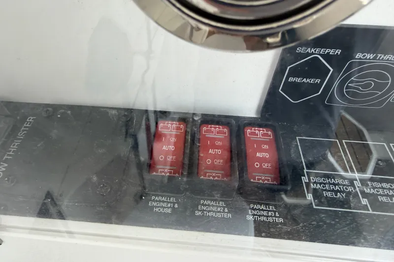 Slide: The Image of Control panel of a 2021 Caymas 341 CC boat with switches and labels. - 39