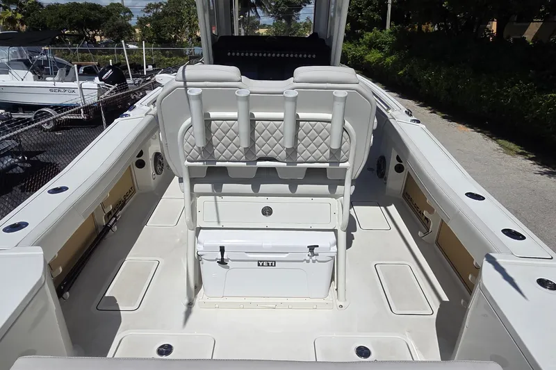 Slide: The Image of 2025 World Cat 260 CC-X boat interior with seating and storage compartments. - 49