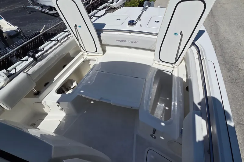 Slide: The Image of 2025 World Cat 260 CC-X boat interior with open storage compartments. - 34