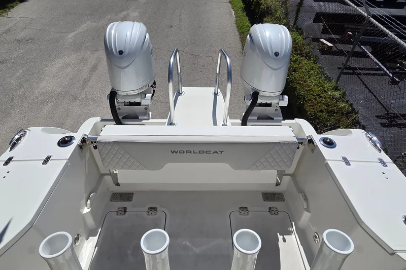 Slide: The Image of 2025 World Cat 260 CC-X boat with dual outboard engines, viewed from the rear deck. - 39