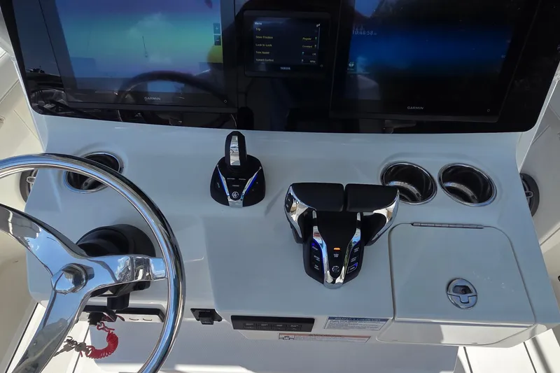 Slide: The Image of 2025 World Cat 260 CC-X helm with steering wheel, dual controls, and Garmin displays. - 46