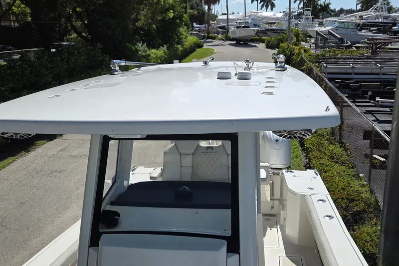 Slide: The Image of 2025 World Cat 260 CC-X boat with sleek design, docked in a marina setting. - 33