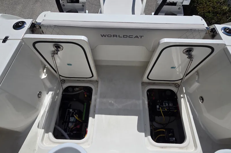 Slide: The Image of 2025 World Cat 260 CC-X boat storage compartments open, revealing interior components. - 43