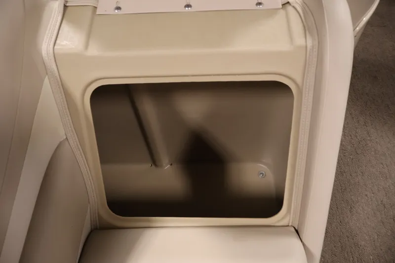 Slide: The Image of Storage compartment in a 2012 Bennington 2075 GS boat, featuring beige interior. - 17