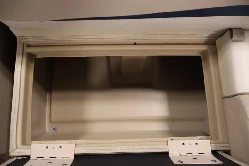 Slide: The Image of Open storage compartment in a 2012 Bennington 2075 GS boat interior. - 13
