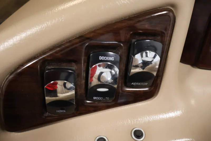 Slide: The Image of Control panel of a 2012 Bennington 2075 GS boat with horn, docking, and aerator switches. - 27