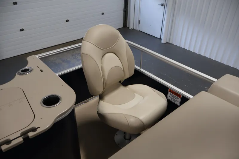 Slide: The Image of Beige captain's chair on 2012 Bennington 2075 GS boat, with console and cup holders. - 39