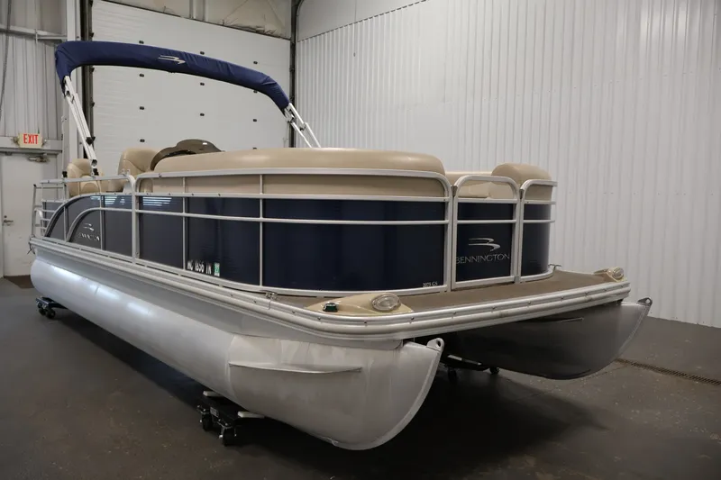 Slide: The Image of 2012 Bennington 2075 GS pontoon boat in indoor storage facility. - 3