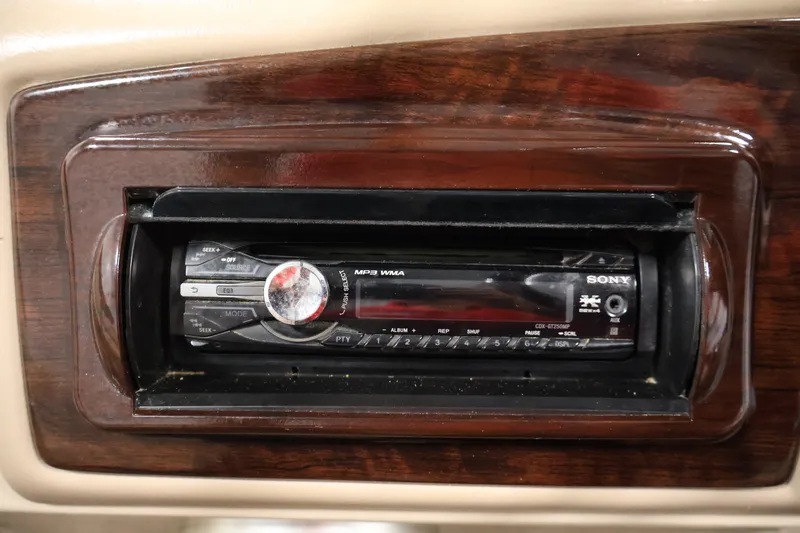 Slide: The Image of Sony car stereo in 2012 Bennington 2075 GS dashboard, featuring MP3 and WMA playback. - 31
